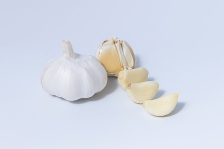 Fresh garlic herb food on a white background.This culinary ingredient adds natural flavor and aroma...