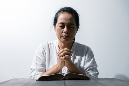 Christian life crisis prayer to god. Woman Pray for god blessing to wishing have a better life....