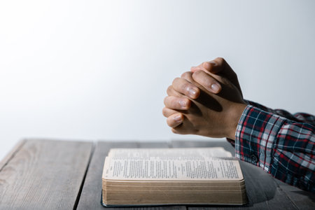 Christian life crisis prayer to god. Woman Pray for god blessing to wishing have a better life. woman hands praying to god with the bible. begging for forgiveness and believe in goodness.の写真素材