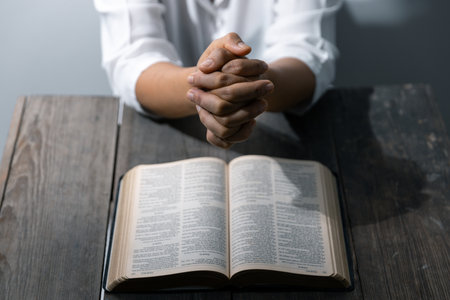 Christian life crisis prayer to god. Woman Pray for god blessing to wishing have a better life. woman hands praying to god with the bible. begging for forgiveness and believe in goodness.の写真素材