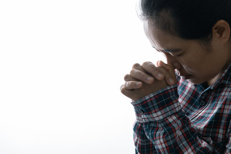 Close up prayer hand pray in church, Pastor pray to God. Christian life crisis prayer to god. Woman Pray for god blessing to wishing have better life. begging for forgiveness and believe in goodness.の写真素材