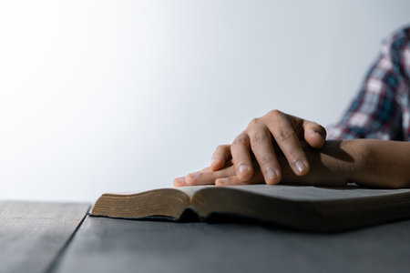 Christian life crisis prayer to god. Woman Pray for god blessing to wishing have a better life. woman hands praying to god with the bible. begging for forgiveness and believe in goodness.の写真素材