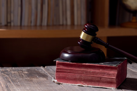 Holy bible book and judge's gavel on table background. Judicial system, constitution, democracy, rule of law. There are no people in the photo. There is free space to insert.の写真素材