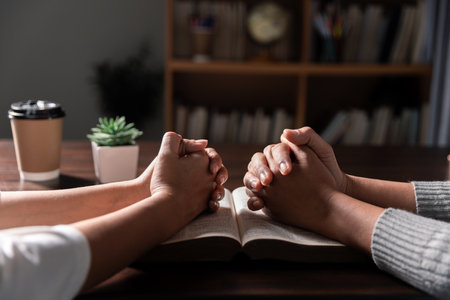 Group of different women praying together, Christians and Bible study concept.の写真素材