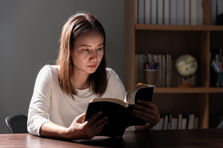 Christian life crisis prayer to god. Woman Pray for god blessing to wishing have a better life. woman hands praying to god with the bible. begging for forgiveness and believe in goodness.の写真素材