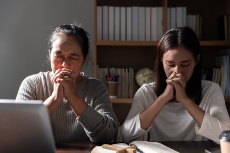 Group of different women praying together, Christians and Bible study concept.の写真素材