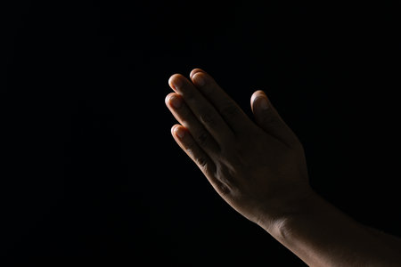 Christian life crisis prayer to god. Woman Pray for god blessing to wishing have a better life. woman hands praying to god with the bible. begging for forgiveness and believe in goodness.の写真素材