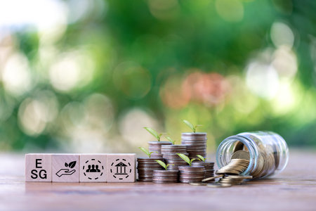 Investing in the environment, society, governance. ESG Investing in the industrial. Green energy invest instead gold coins growing. Concept of Savings in ESG Mutual Funds, Sustainable Business.の写真素材