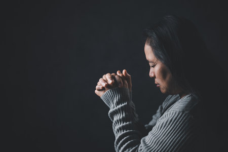 Christian life crisis prayer to god. Woman Pray for god blessing to wishing have a better life. woman hands praying to god with the bible. begging for forgiveness and believe in goodness.の写真素材