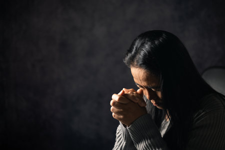 Christian life crisis prayer to god. Woman Pray for god blessing to wishing have a better life. woman hands praying to god with the bible. begging for forgiveness and believe in goodness.の写真素材