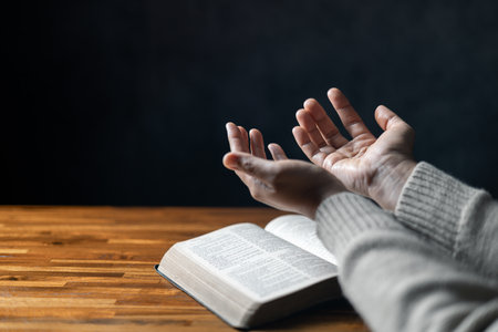Christian life crisis prayer to god. Woman Pray for god blessing to wishing have a better life. woman hands praying to god with the bible. begging for forgiveness and believe in goodness.の写真素材
