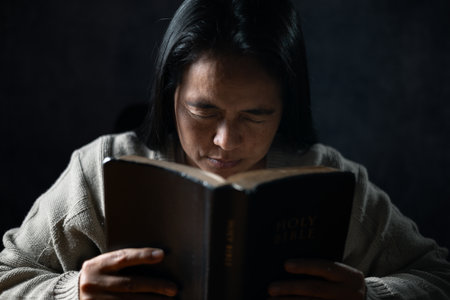 Christian life crisis prayer to god. Woman Pray for god blessing to wishing have a better life. woman hands praying to god with the bible. begging for forgiveness and believe in goodness.の写真素材