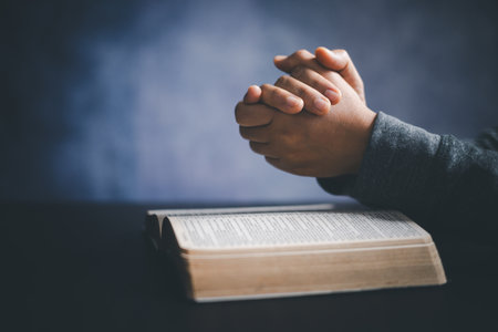 Christian life crisis prayer to god. Woman worship for god blessing to wishing have a better life. woman hands praying to god with the bible. begging for forgiveness and believe in goodness.の写真素材