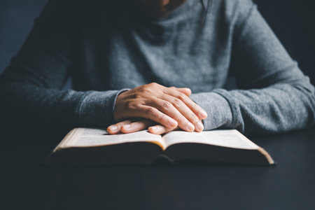 Christian life crisis prayer to god. Woman worship for god blessing to wishing have a better life. woman hands praying to god with the bible. begging for forgiveness and believe in goodness.の写真素材