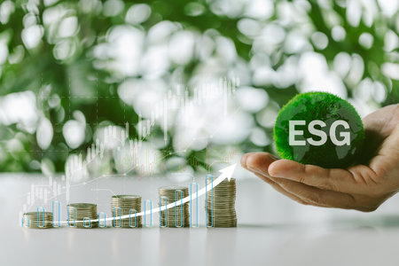 Concept of green business, finance and sustainability investment. Stack of silver coins the seedlings are growing on top with arrow of growth and icons.Carbon credit. ESG, Co2, NetZero.の写真素材