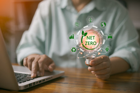 Carbon dioxide emission in industry net zero carbon concept. woman hand with net zero icon. Sustainable energy with co2 affects global warming. Carbon neutrality goal Greenhouse gas emissions 2050の写真素材
