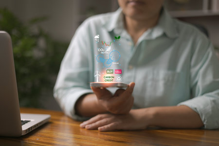 Carbon credit market concept. Green energy, Businesswoman with Carbon credit icon. Net zero in 2050 year. Green energy icon around it. Carbon Neutral in industry Net zero emission eco energy.の写真素材