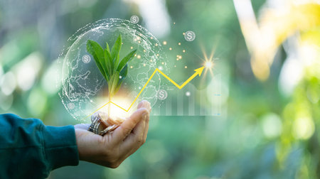 Hand holding tree grows on coin pile. Growing money, finance and investment. Seedling are growing with business arrow of growth. Concept of economy green growth, profit, development and success.の写真素材