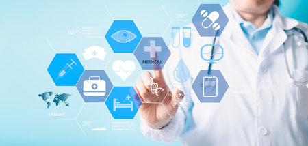 Medicine doctor hand working with modern computer interface as medical concept. Pandemic develop people awareness and spread attention on their healthcare in hospital and health insurance business.の写真素材
