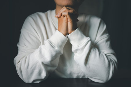 Woman hands praying to god. Christian life crisis prayer to god. Woman pray for god blessing to wishing have better life. Female hands worship to god. begging for forgiveness and believe in goodness.の写真素材
