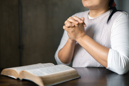 Female hands worship to god. Woman hands praying to god. Christian life crisis prayer to god. Woman pray for god blessing to wishing have better life. begging for forgiveness and believe in goodness.の写真素材