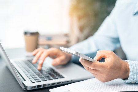 Business woman working on documents looking concentrated with briefcase on table. Businesswoman is deeply reviewing a financial report for a return on investment or investment risk analysis.の写真素材