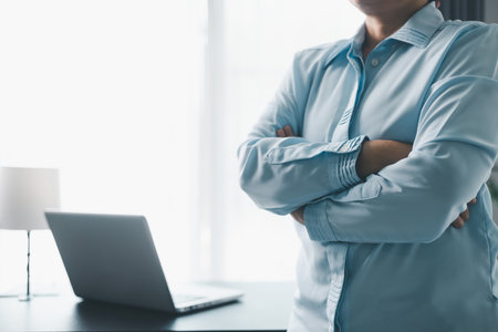 Female entrepreneur working in home office at her desk. Business woman entrepreneur in office using laptop at work, professional middle aged female company executive working on computer at workplace.の写真素材
