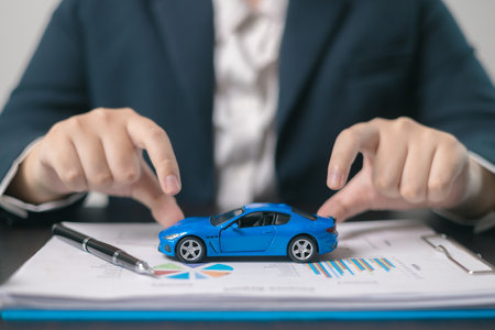 Agent facilitated a business deal, finalizing the agreement for automobile insurance to protect the vehicle during transport. car insurance concept.の写真素材