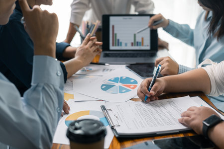 Financial analyst presented a detailed data analysis graph to their colleague, corporate office, demonstrating the business's financial status and trends. Concept of business data analysis.の写真素材
