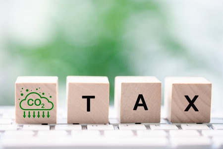 Carbon tax and emissions trading systems are designed to price CO2 emissions, allowing companies to purchase credits to offset carbon output and market-driven approach to mitigating climate change.の写真素材