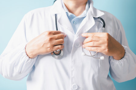Professional doctor, equipped with a stethoscope, provided exceptional health care at the clinic, skilled surgeon performed critical operations at the hospital, ensuring comprehensive medical care.の写真素材