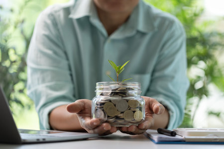 Concept of green finance encourages businesses to invest money in sustainable projects, planting seeds of growth and cultivating wealth through eco-friendly investments. finance, green, business.の写真素材