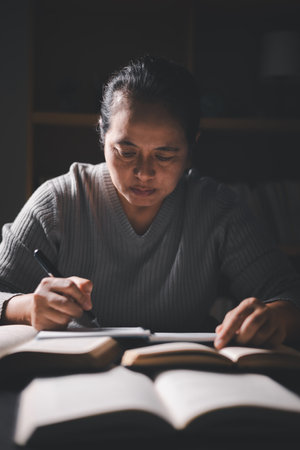 Woman with Bible in her hand, faith in God strengthened by holy words of book, found solace and...