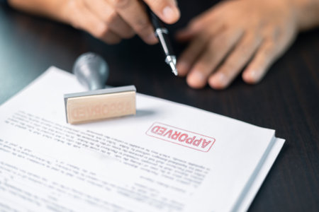 Businesswoman confidently placed her stamp of approval on legal document, finalizing the contract and solidifying the agreement in office with her authority. document, approve, business, stamp.の写真素材