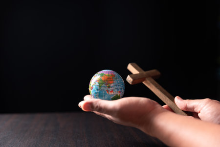 Missionary embarked on mission across the earth, armed with faith in Jesus Christ and a map, spreading the teachings of Christianity and the Bible to fulfill God's call within the Christian religion.の写真素材