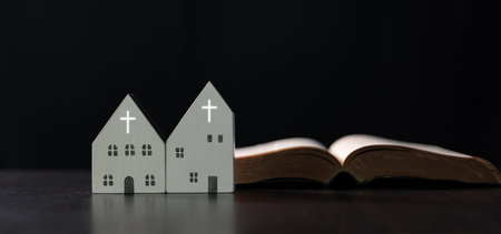 Modern church building, with a cross prominently displayed, serves as a place of worship for the Christian community, blending the traditional Catholic faith with a contemporary home-like background.の写真素材
