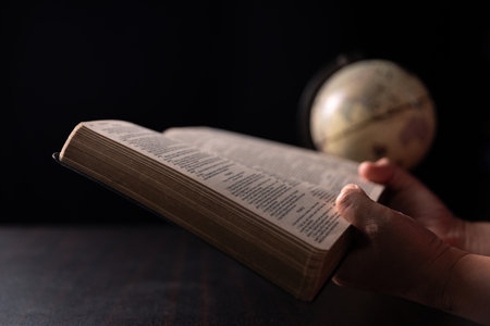Missionary embarked on mission across the earth, armed with faith in Jesus Christ and a map, spreading the teachings of Christianity and the Bible to fulfill God's call within the Christian religion.の写真素材