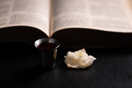 Communion, Christians celebrate their faith by partaking in bread and wine, symbolizing the body and blood of Jesus Christ, as taught in the Bible and cherished in their holy religion. communion, holyの写真素材