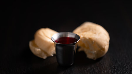 Christian religion, believers partake in Holy Communion, sacred eucharist sacrament symbolizing bread and blood of Christ, deepening their spirituality and faith. communion, christian, holy, religionの写真素材