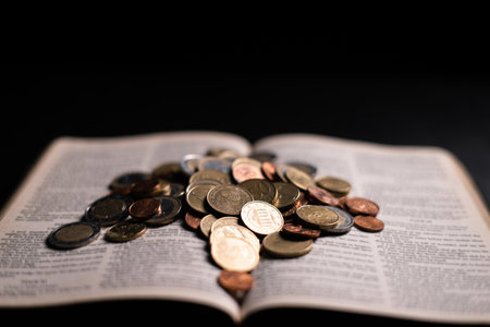 A passage in the Bible emphasizes the virtue of charity, encouraging people to give coins and donations, demonstrating the intersection of finance, religion, and the spirit of giving. coin, bible.の写真素材