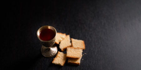 Christian religion, believers partake in Holy Communion, sacred eucharist sacrament symbolizing bread and blood of Christ, deepening their spirituality and faith. communion, christian, holy, religionの写真素材