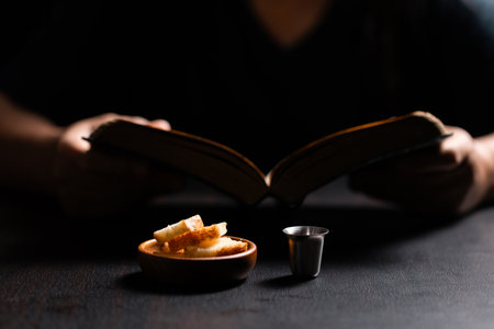 Sacred ceremony of Communion, Christians express their faith by partaking in holy bread, deepening their spiritual connection with God within the church. communion, religion, christian, faith, holy.の写真素材