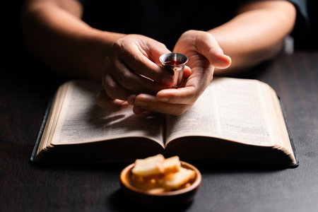 Sacred ceremony of Communion, Christians express their faith by partaking in holy bread, deepening their spiritual connection with God within the church. communion, religion, christian, faith, holy.の写真素材