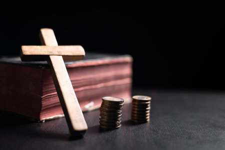 A passage in the Bible emphasizes the virtue of charity, encouraging people to give coins and donations, demonstrating the intersection of finance, religion, and the spirit of giving. coin, bible.の写真素材