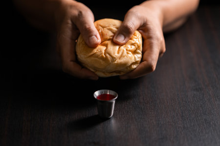 Sacred ceremony of Communion, Christians express their faith by partaking in holy bread, deepening their spiritual connection with God within the church. communion, religion, christian, faith, holy.の写真素材
