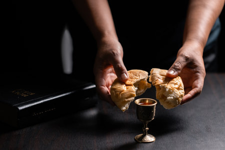 Sacred ceremony of Communion, Christians express their faith by partaking in holy bread, deepening their spiritual connection with God within the church. communion, religion, christian, faith, holy.の写真素材