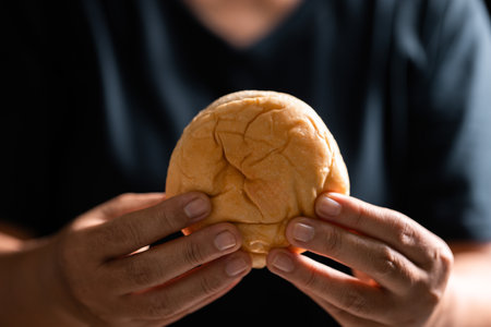 Sacred ceremony of Communion, Christians express their faith by partaking in holy bread, deepening their spiritual connection with God within the church. communion, religion, christian, faith, holy.の写真素材