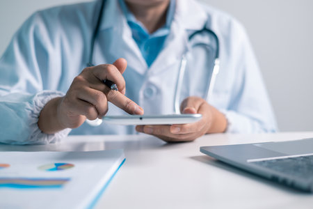 Doctor, equipped with a stethoscope, provided medical care to the patient at clinic, ensuring their health and well-being as a dedicated physician in the health care system. doctor, medical, health.の写真素材