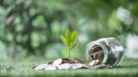 Coin symbolizes growth of investment, as money nurtures a green plant, representing the path to financial success in business and the broader economy. coin, growth, investment, money, green, plant.の写真素材