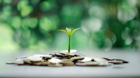 Coin symbolizes growth of investment, as money nurtures a green plant, representing the path to financial success in business and the broader economy. coin, growth, investment, money, green, plant.の写真素材
